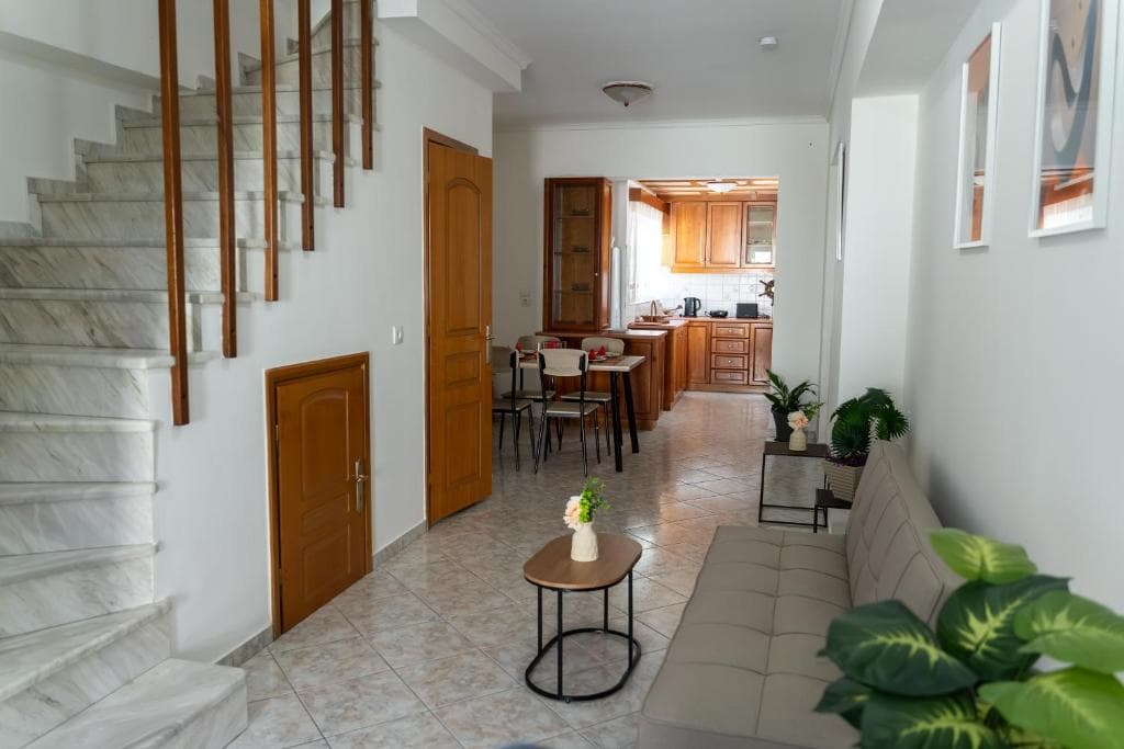 Nerina Maisonette main floor with staircase and kitchen view